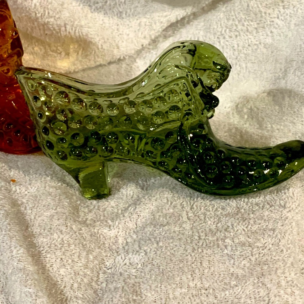 Fenton green glass shoe with cat draping over.